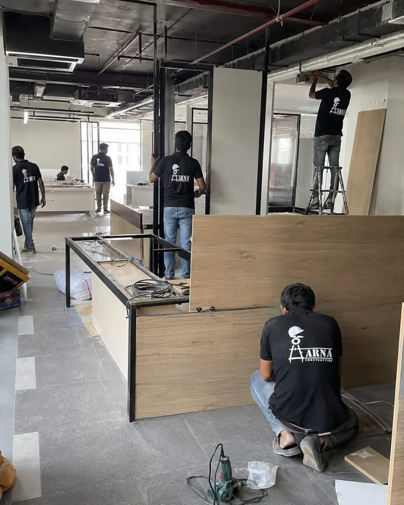 Cafe interior woodwork by Aarna Constructions in Greater Noida