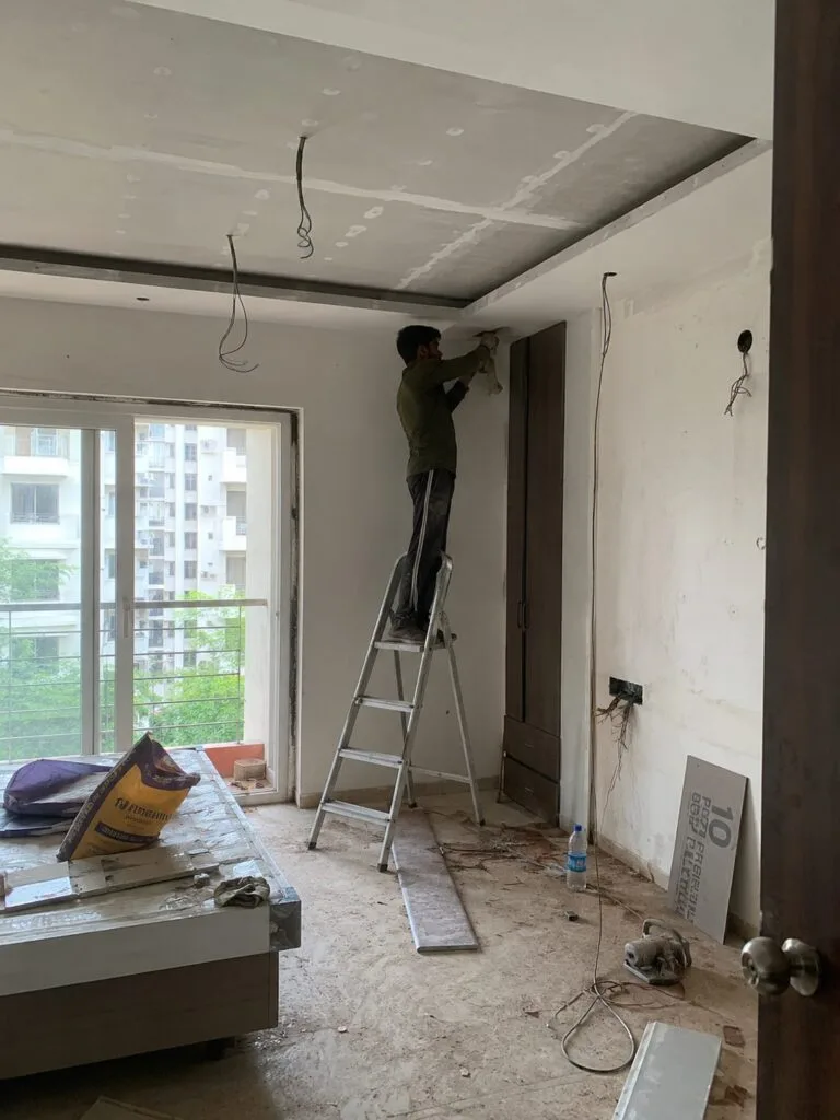 Modular kitchen installation by Aarna Constructions in Greater Noida