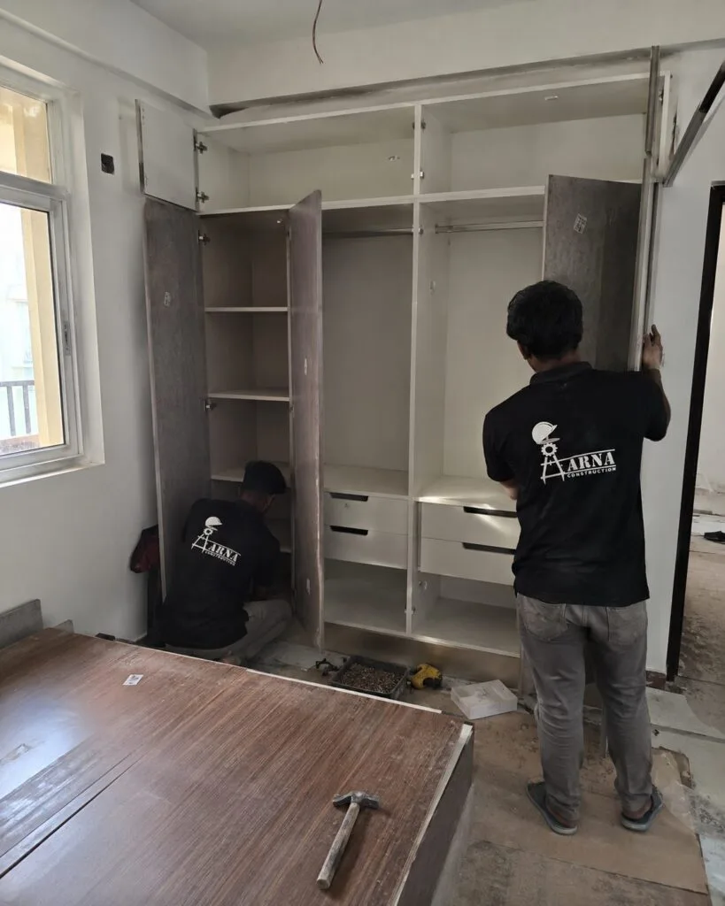 Modular wardrobe carcass installation by Aarna Constructions in Greater Noida