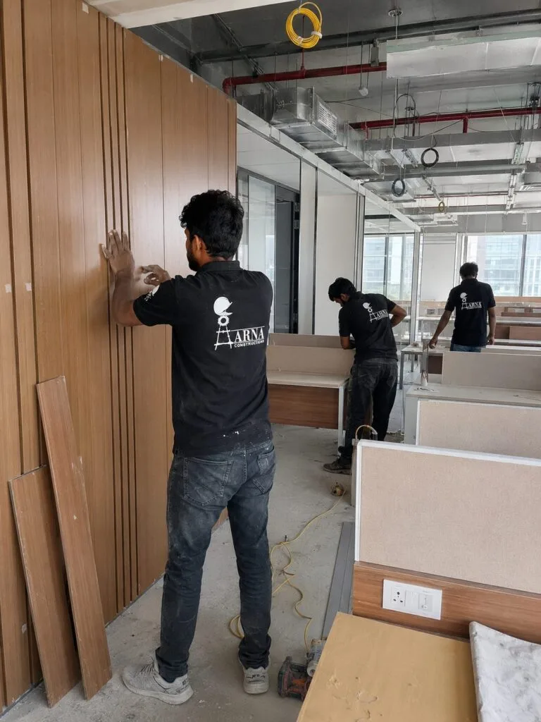 Wooden wall paneling work by Aarna Constructions in Greater Noida