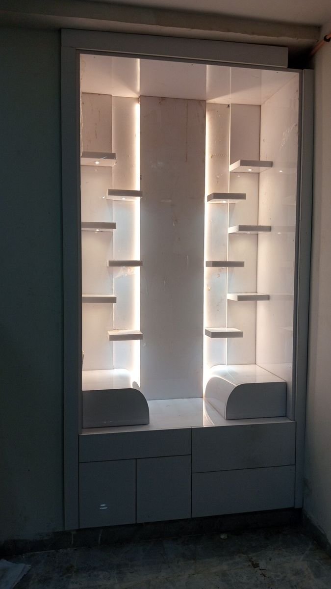 Built-in white display unit with LED strip lighting, made for a home in Greater Noida